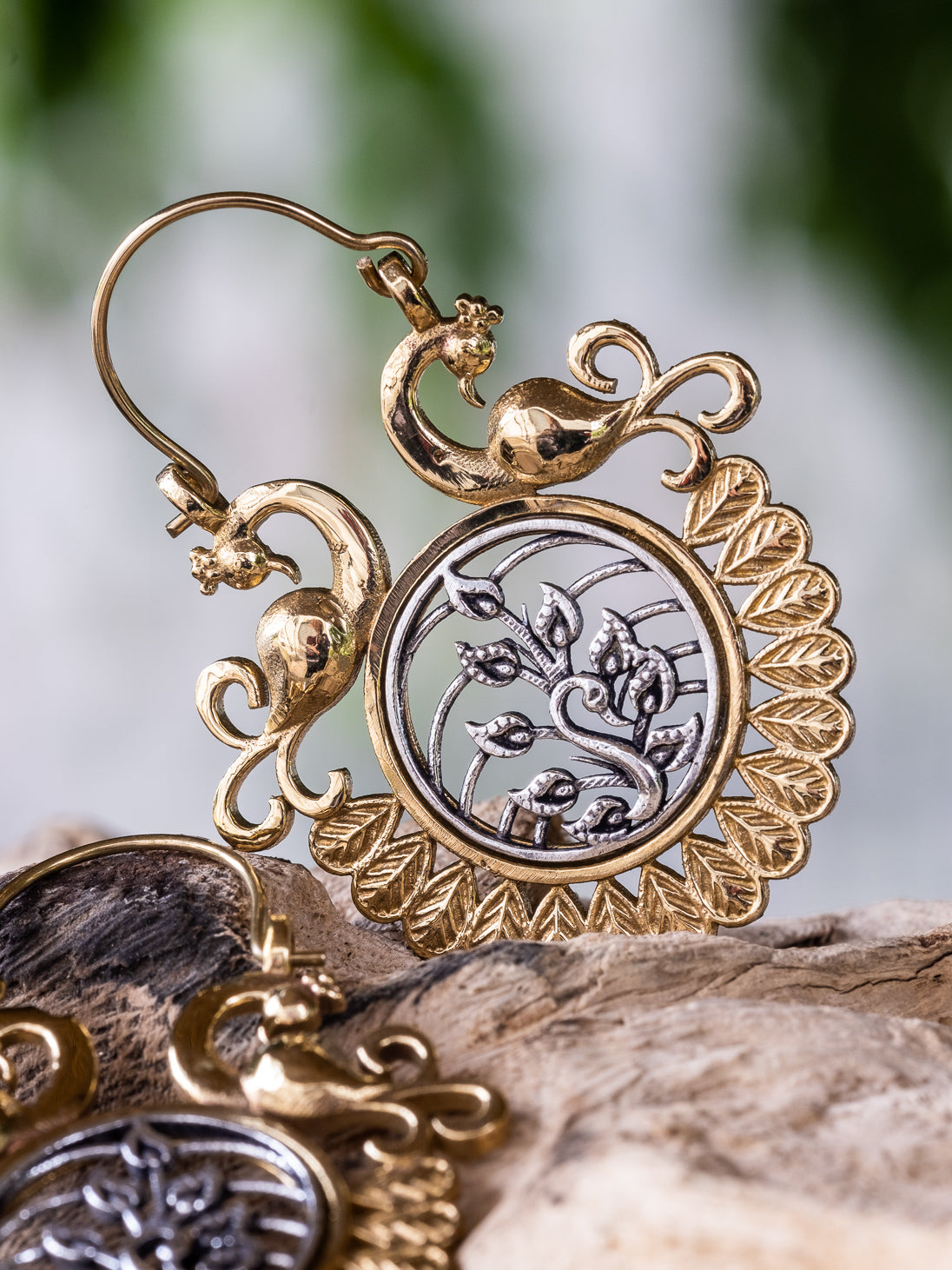 Round silver earrings with internal frets and hook closure